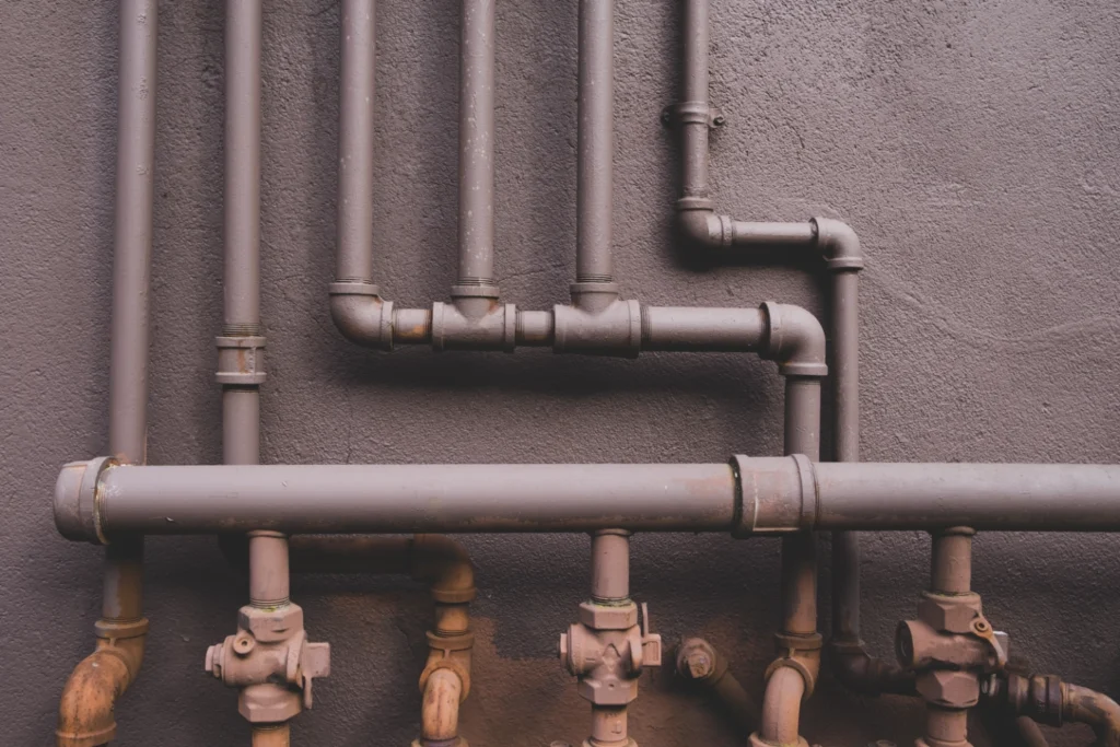 Exposed residential plumbing pipes ready for a plumbing camera inspection