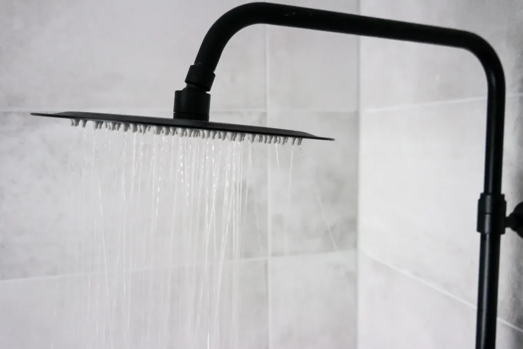 Newly installed shower head after a plumbing fixture replacement