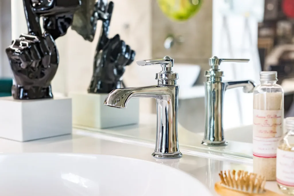 Plumber completing a sink and faucet replacement in a Greenville, SC home